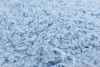 A close-up view of light blue fluffy yarn. Produktbild-Vorschau