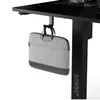 A laptop bag is hanging from a hook under a desk. Anteprima dell’immagine prodotto