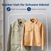 Two jackets are hanging on a clothing rack in front of a light gray and white background, with shelves visible on the left. Produktbild-Vorschau