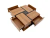 A square coffee table with four drawers pulled out, shown from a high angle against a white background. Voir les images du produit