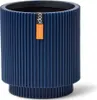 A dark blue cylindrical planter with a ribbed texture and a small orange and white tag attached to the side. Produktbild-Vorschau