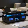 A modern living room scene featuring a black high-gloss coffee table with integrated blue LED lighting, a laptop, and decorative items. Náhled obrázku produktu