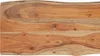 A close-up view of a wooden tabletop with a live edge. Náhled obrázku produktu