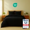 A black duvet cover and pillow set is displayed on a bed. Produktbild-Vorschau