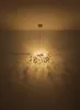 A chandelier hangs from the ceiling, casting light and shadows on the walls. Anteprima dell’immagine prodotto