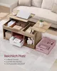 A lift-top coffee table with storage, shown in a living room setting with a sofa in the background. Produktbild-Vorschau