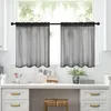 A kitchen counter with a window above, decorated with two black sheer curtains. Voir les images du produit