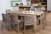 A dining set with chairs and a table in a kitchen setting. Anteprima dell’immagine prodotto