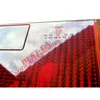 Close-up of a car taillight with text and branding. Voir les images du produit