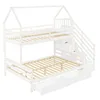 A white bunk bed with a house-shaped frame, stairs, and drawers, shown against a white background. Produktbild-Vorschau