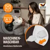 A woman is putting a white blanket into a washing machine, with icons indicating washability and temperature. Náhled obrázku produktu