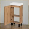 A bathroom cabinet with a sink on top, shown with the door open. Podgląd zdjęcia produktu