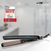 A black Clatronic hair straightener with gold plates is displayed on a white surface, with a marketing badge in the top left corner and the Clatronic logo in the top right. Podgląd zdjęcia produktu