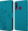 A teal flip phone case with a floral and butterfly design on the front cover and a camera cutout on the back. Náhľad obrázku produktu