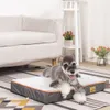 A dog is lying on a dog bed in a living room setting. Náhled obrázku produktu