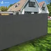 A grey privacy screen fence is installed in a garden in front of a house. Produktbild-Vorschau