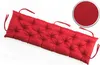 A red tufted bench cushion on a white background. Produktbild-Vorschau