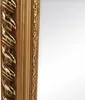 A close-up view of the ornate frame of a mirror. Náhľad obrázku produktu