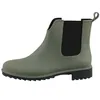 A side view of a green Chelsea boot with a black sole and elastic side panels. Anteprima dell’immagine prodotto