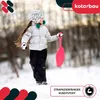 A young girl in winter clothing holding a pink sled in a snowy environment. Voir les images du produit
