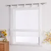 A white sheer Roman blind is shown hanging on a window. Produktbild-Vorschau