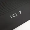 A close-up of the "ID.7" logo on a black textured surface. Produktbild-Vorschau