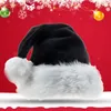 A black Santa hat with a white trim is displayed against a red background with festive Christmas decorations. Produktbild-Vorschau