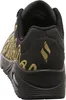 A close-up rear view of a black and gold Skechers sneaker. Voir les images du produit