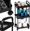 A black three-tier rolling cart filled with bathroom or kitchen items. Voir les images du produit