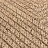 A close-up view of a textured rug with a herringbone pattern. Voir les images du produit