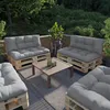 An outdoor patio seating area with pallet furniture and cushions. Produktbild-Vorschau