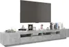 A TV stand with a television on top and various decorative items on the stand. Produktbild-Vorschau