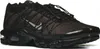A pair of black and brown Nike Air Max Plus TN Utility sneakers. Voir les images du produit