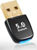 A close-up studio shot of a black and gold USB Bluetooth adapter with blue LED light. Produktbild-Vorschau