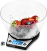 A digital kitchen scale with a bowl of fruit. Produktbild-Vorschau