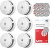 A collection of smoke detectors and mounting kits arranged on a white background. Produktbild-Vorschau