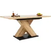 A wooden dining table with a black base, set against a white background. Anteprima dell’immagine prodotto