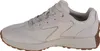 A side view of a beige Skechers sneaker with a brown sole. Produktbild-Vorschau