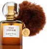 A bottle of perfume with a fluffy charm and a gold pendant. Voir les images du produit