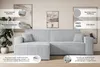 A light gray sectional sofa is shown in a living room setting with artwork on the walls and a plant in the foreground. Text overlays highlight features of the sofa. Produktbild-Vorschau