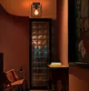 A hallway with a ceiling light, glass block wall, and a chair. Náhľad obrázku produktu