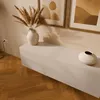 A modern living room setting with a lowboard, vase with dried flowers, and decorative vase. Náhľad obrázku produktu