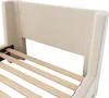 A close-up view of the headboard and wooden slats of a beige upholstered bed frame. Produktbild-Vorschau