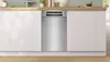 A modern kitchen with a stainless steel dishwasher integrated into white cabinets. Produktbild-Vorschau