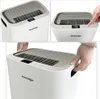 A collage of three images showing a white dehumidifier from different angles, with close-ups of the display and controls, and a hand interacting with the product. Anteprima dell’immagine prodotto