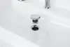 A close-up shot of a white sink with a chrome drain stopper and drain. Podgląd zdjęcia produktu