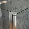 Close-up of a shower enclosure corner with a chrome fitting and glass panel. Produktbild-Vorschau