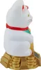 A white Maneki-neko (lucky cat) figurine with a red collar and green bib, sitting on a gold tiered base, shown in profile. Produktbild-Vorschau