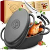 A cast iron Dutch oven with a roasted chicken inside, along with a recipe book and kitchen shears, presented on a white background. Voir les images du produit