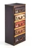 A tall, narrow chest of drawers designed to look like stacked vintage suitcases. Podgląd zdjęcia produktu